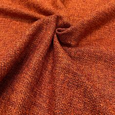 an orange fabric with small dots on it