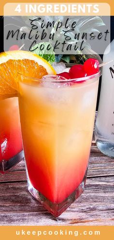 an orange and red drink sitting on top of a wooden table