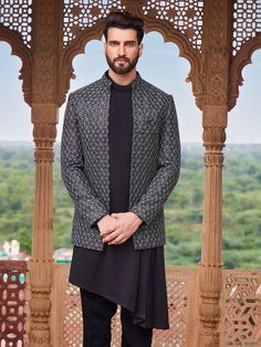 The classy black terry rayon indowestern with embroidery work, it is sure to fetch you compliments from all. Comes with a bottom. Indian Wedding