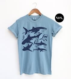 Vintage 90s Whale Shark Tshirt ⭐ Welcome to K & K Custom Tees! ⭐  - Indulge in pure comfort with our Comfort Colors Shirt. Soft, relaxed, and available in a variety of colors! ⭐SHIRT DETAILS⭐  -High Quality fabric  -100% ring-spun US cotton -Designed and printed in the USA  ⭐ PLEASE NOTE ⭐ -For an oversized look, we suggest to size up 1-2 sizes. These shirts run like standard unisex tees. Please see size chart for a more fitted look!  -Colors may vary based on your monitor or screen display! ⭐CA Cheap Crew Neck T-shirt With Shark Design, Whale Tee Shirt, Cheap Crew Neck T-shirt With Fish Print, Whale Shark Clothes, Whale Shark Shirt, Concept Outfits, Shark Clothes, Granola Fits, Shark Shirts