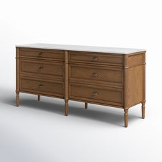 a wooden dresser with marble top on white background