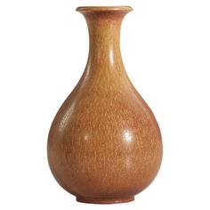 a wooden vase is shown against a white background