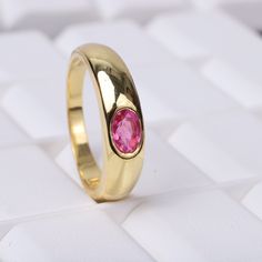 Vintage Ruby Wide Band Ring, Wedding Ring, 14k Solid Gold, Christmas Gift, Unisex Ring, July Birthstone, Promise Ring, New Year Jewelry Ring Description:- Main Stone- Ruby Cut of Stones - Faceted Stone size - 4x6 mm Stone Color- Pink Stone Shape - Oval Creation- Lab Created Birthstone - July Stone Grade - AAA+ Check out my other items! PAYMENTS We accept PayPal, If we do not receive payments immediately we will hold the item only for one working day for your payments and we will be re-listing th Gold Emerald Ring For Marriage, Gold Emerald Open Ring For Wedding, Gold Emerald Ring With Bezel Setting For Wedding, Gold Ruby Ring With Center Stone In Round Band, Gold Ruby Ring With Center Stone And Round Band, Gold Cubic Zirconia Sapphire Ring For Wedding, Gold Sapphire Ring With Cubic Zirconia For Wedding, Vvs Clarity Oval Ruby Ring For Wedding, Oval Ruby Ring With Vvs Clarity For Wedding