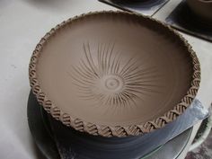 a brown bowl sitting on top of a table