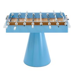 a blue table top foosball sitting on top of a metal stand with white knobs