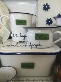 vintage enamel ware is stacked on top of each other in blue and white dishes with matching labels