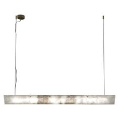 a rectangular light fixture with two lights on each side and one hanging from the ceiling