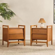 two wooden nightstands sitting next to each other on top of a carpeted floor