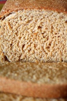 a close up view of a loaf of bread with the crust still on it's side