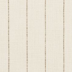 a white and brown striped wallpaper with small dots on the bottom half of it