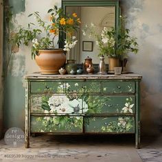 a dresser with flowers painted on it and a mirror in the corner next to it