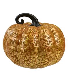 a golden pumpkin with an intricate design on it