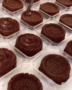 chocolate desserts in plastic containers on a table