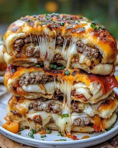 three cheeseburger sandwiches stacked on top of each other