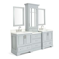 a bathroom vanity with two sinks and mirrors