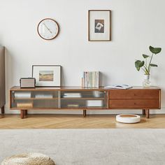 a living room scene with focus on the coffee table and sideboard in the foreground