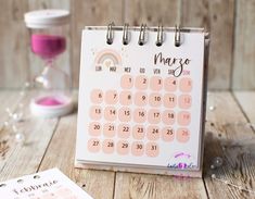 a calendar sitting on top of a wooden table