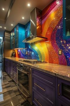 a colorful kitchen with stainless steel appliances and marble counter tops