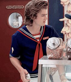 a man standing in front of a display case