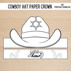 the cowboy hat paper crown is on top of a wooden board with an image of a star