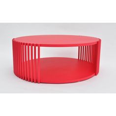 a red coffee table with two shelves on each side