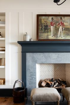 a living room filled with furniture and a fire place in front of a painting on the wall