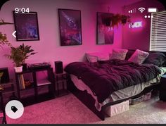 a bedroom with pink lighting and black furniture