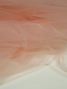 an orange and white background with tulle on it's side, as seen from above