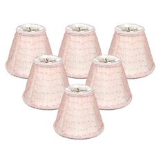 six pink lampshades with white trim