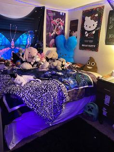 a bed with stuffed animals on top of it in a room filled with posters and lights