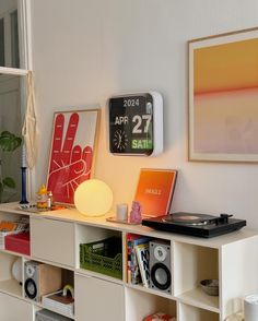 a white shelf with various items on it