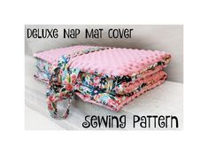 a pink quilted blanket with flowers on it and the words deluxe nap mat cover sewing pattern