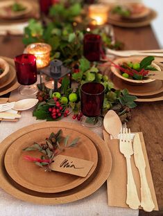 the table is set with place settings for dinner