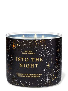 bath and body works into the night scented candle in black tin with gold stars on it