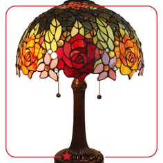 a stained glass lamp with roses on it