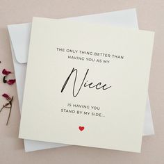 a card with the words nice on it next to some flowers and a pair of scissors