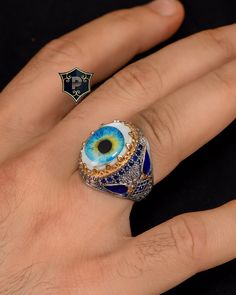 "Evil Eye Men Ring, Evil Eye Ring, 925 Sterling Silver Ring, Mother of pearl Gemstone Ring, Turkish Ring, Handmade Ring, Gift for Him ✦ Details ✦ * Material: 925 Sterling Silver * Gemstone: Turquoise  * Weight: 16.00 grams. * The size of the stone: 15x20 mm. * Sides oxidized, decorated with Micro Turquoise stones. * Stamp: 925 * Available sizes; 5 US to 16 US. Contact me if you need any other size! ✦ Shipping ✦ * Processing time: 1-3 business days. * This item ships from my Turkish workshop in Istanbul. * Add your phone number in address box for a smoother delivery. That makes courier personnel's job easier.  ✦ Packaging ✦ * Comes with a luxury gift box and a jewellery cleaning cloth and courtesy gift. ✦ Returns, Exchanges ✦ * Return option available for 30 days after the delivery. * The p Turkish Ring, Turkish Rings, Evil Eye Ring, Men Ring, Eye Ring, Turquoise Stones, Pearl Gemstone, Evil Eye Jewelry, Ring Handmade