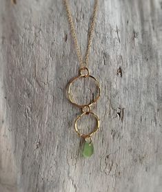 16" Gold Filled Necklace with two wavy hoop pendants and an olive green sea glass gem (mermaid tear).  This sea glass has been tumbled in the ocean for many years with rounded, natural edges and curves. Each piece of glass is one of a kind, making it truly unique and special. Each piece of sea glass is carefully selected for each design by colour, shape and size. Lots of time goes into searching for these pieces, I hope you treasure these pieces as much as I do. The mystery of sea glass is capti Natural Edges, Mermaid Tears, Glass Gems, Green Sea, Sea Glass Necklace, Glass Necklace, Gold Filled Chain, Sea Glass, Charm Necklace