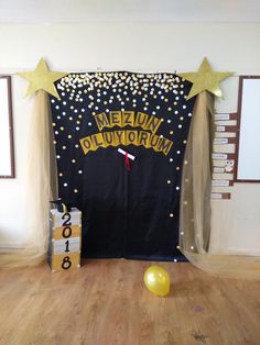 a room decorated for a new year's eve celebration with balloons and streamers