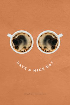 two cups of coffee with the words have a nice day written on them in front of their eyes