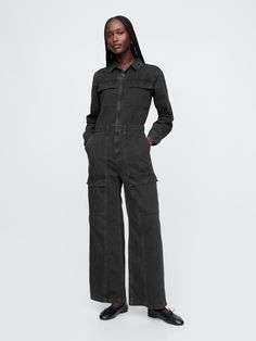 Authentic, no-stretch denim jumpsuit.  Point collar, button front.  Long sleeves.  Patch pockets at chest.  Elasticized waist.  Front slant pocket, back patch pockets.  Cargo pockets at sides.  Responsibly Made: This denim jumpsuit is made with 5% recycled cotton and is part of our water-saving Washwell program.  Compared with conventional wash methods, Washwell uses at least 20% less water and has saved over a billion liters of water since 2016.  Fit: Slim.  A fitted silhouette that fits close to the body.  Full-length, wide leg.  Models wearing Gap Cargo Jumpsuit, Denim Cargo, Water Saving, Jumpsuit Black, Gap Denim, Back Patch, Fitted Silhouette, Denim Jumpsuit, Black Jumpsuit