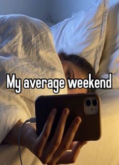 someone is laying in bed and looking at their cell phone that says, my average weekend