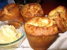 several muffins and butter on a plate