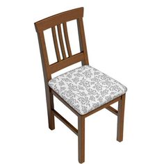 a wooden chair with a patterned seat pad on the back of it, against a white background