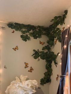 a bedroom with butterflies on the wall and lights strung from the ceiling over the bed