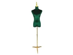 a green mannequin on a gold stand