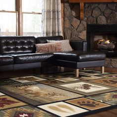 a living room filled with furniture and a fire place in the middle of the room