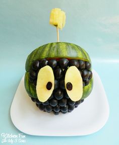 a cake made to look like a fruit with eyes