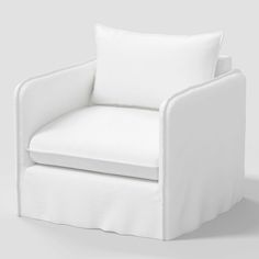 a white chair sitting on top of a white floor