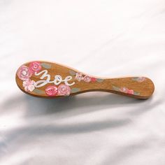 Introducing my charming hand-painted wooden baby hair brushes!! Each brush is painted with delicate flowers and personalized with my signature style of hand lettered name. Crafted from solid wood, the baby brush measures 6 inches tall by 1.5 inches wide, and the kids brush measures 9.5 inches tall by 3 inches wide. Whether as a cherished keepsake or a thoughtful gift, my hand-painted wooden baby hair brushes are the perfect choice for any baby girl's essentials! Shipping Processing time for cust Wooden Hair Brush Painted, Painted Hairbrush, Painted Brush, Wooden Hair Brush, Baby Hair Brush, Wooden Brush, Custom Wooden Signs, Wooden Comb